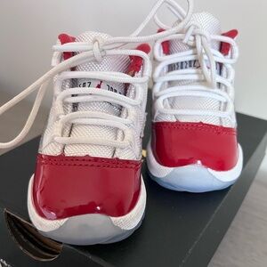 White & red toddler Jordan 11’s